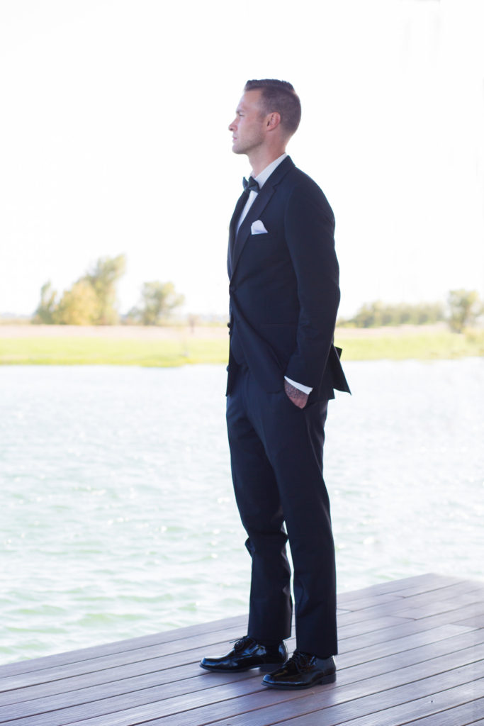 groom-looking-over-lake